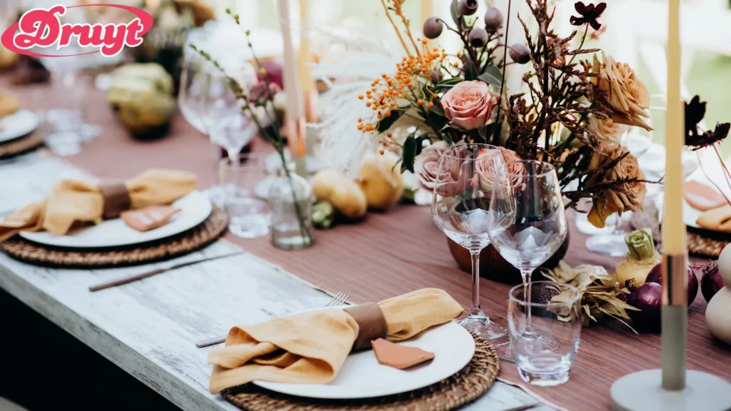 A beautifully set table with floral centerpieces and elegant place settings. Can you get invited to a wedding? Your connection with the couple usually determines the likelihood of an invitation!